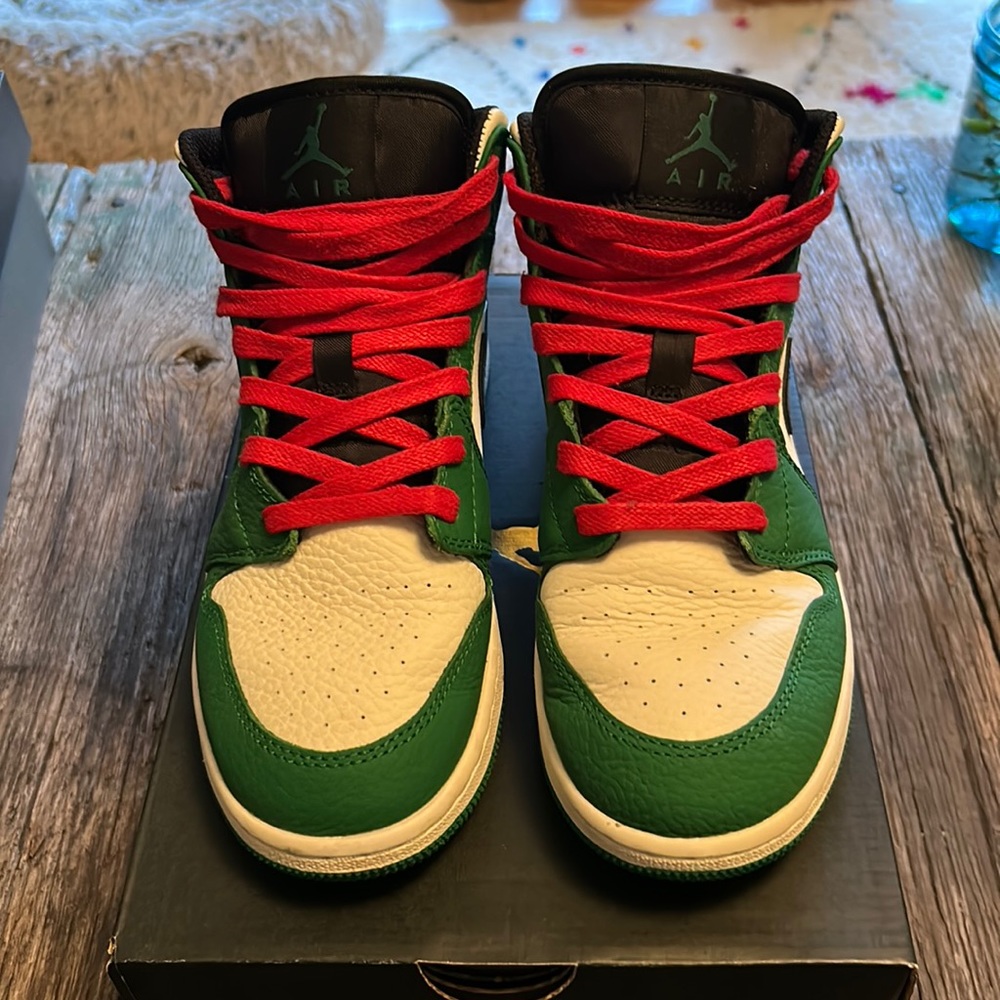 Jordan 1 Mid. In pine green. With red laces. Size 6 GS. Will fit women’s 7-7.5